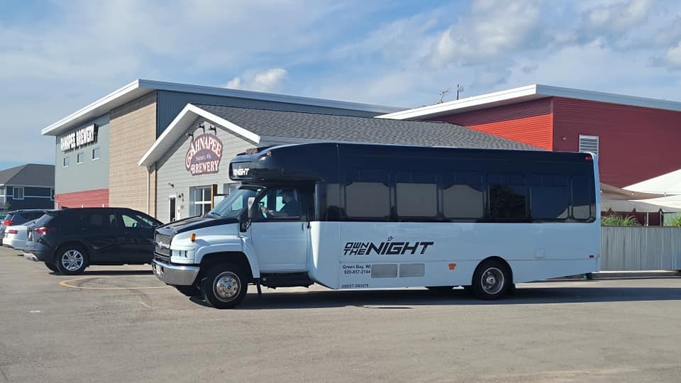 The bus parked at Ahnapee Brewery.