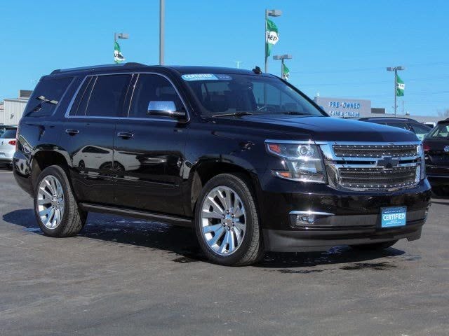 Black Chevrolet Tahoe, driver side exterior.